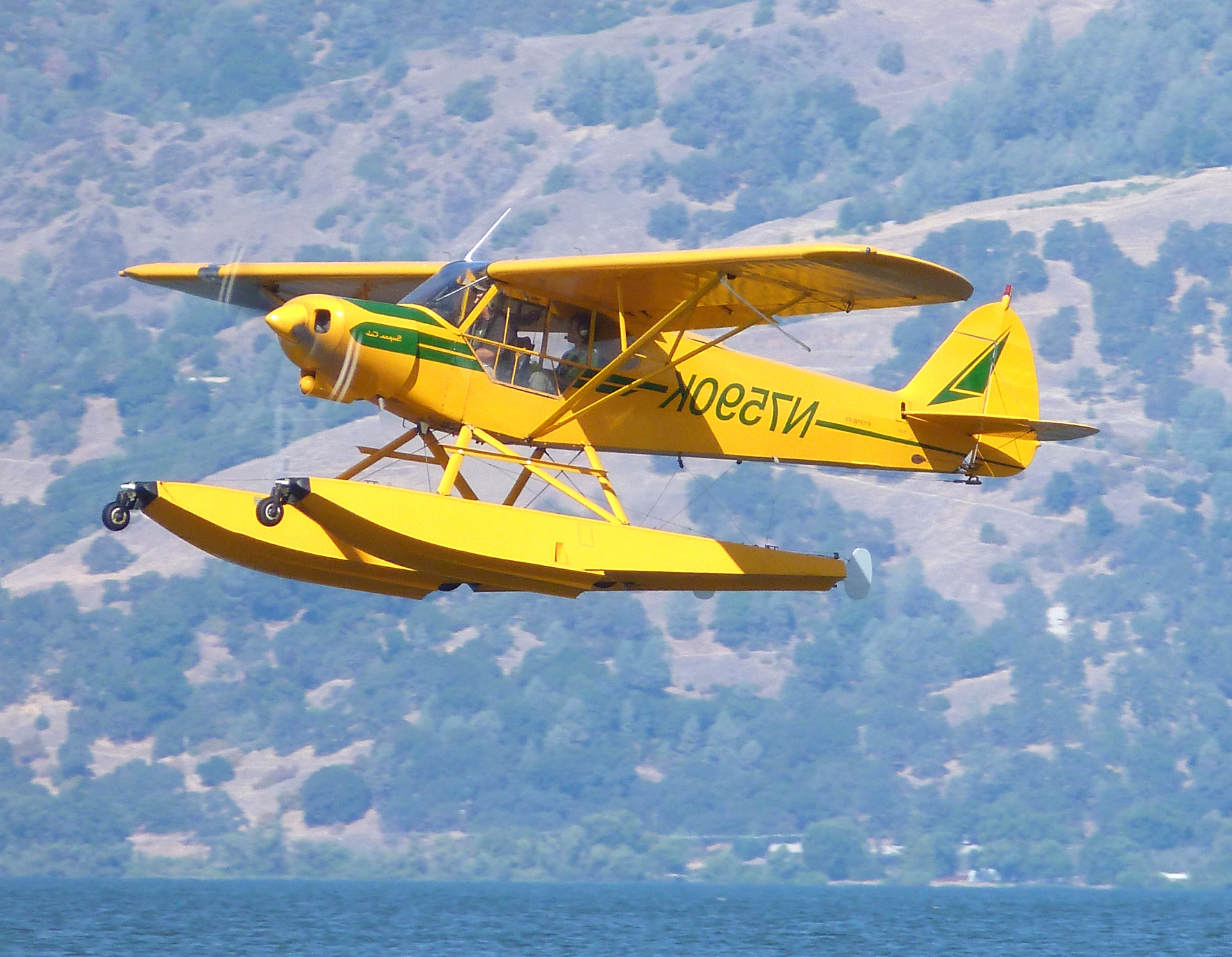 a float plane landing on water